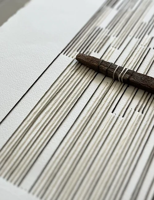 Detail of a hand-stitched Vertical Works artwork